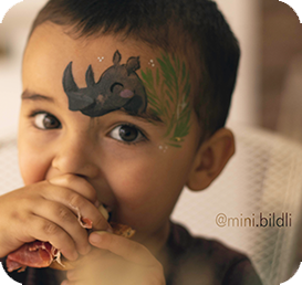 Child with Rhinoceros face painting design