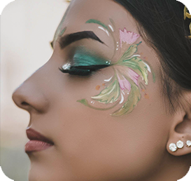 profile of a woman with flowers in shades of green drawn on her face