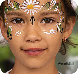 Girl with face paint flower design